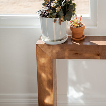 Arched Built-Ins Meet Terracotta Tile in a Light-Filled Sunroom Addition