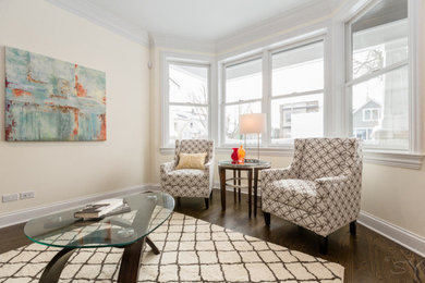 Inspiration for a modern medium tone wood floor living room remodel in Chicago with beige walls