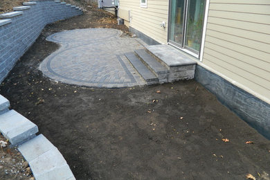Inspiration for a contemporary patio in Minneapolis with concrete pavers.