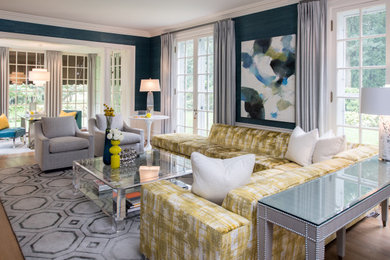 Example of a large transitional formal light wood floor and orange floor living room design in Boston with blue walls