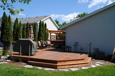This is an example of a contemporary deck in Milwaukee.