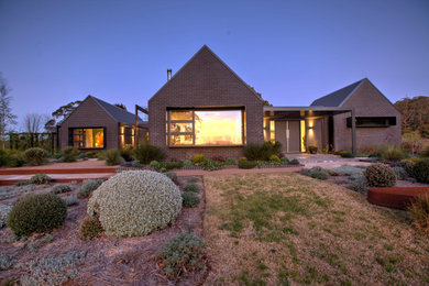 Photo of a country home design in Wollongong.