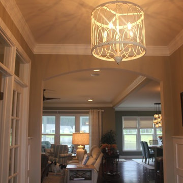 Entry foyer with custom wainscoting and crown molding