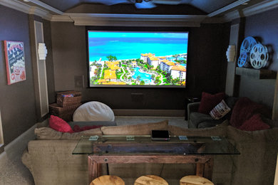 Inspiration for a rustic home theater remodel in Miami