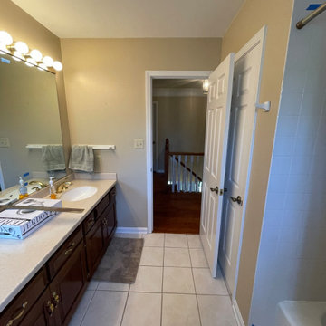 Timeless White Vanity Paired with Luxury Tiled Shower