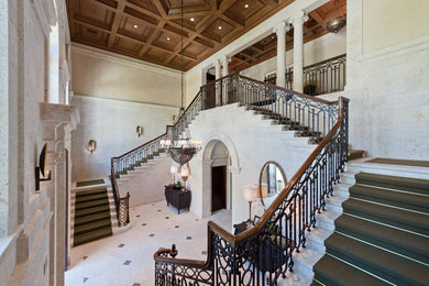 Design ideas for an expansive traditional foyer in Miami with beige walls and marble floors.