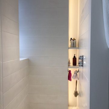 Concrete bathroom finishes - tiles, floor, sink.Private residence - Manhattan.