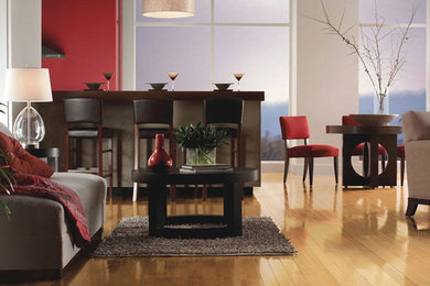 Example of a large trendy formal and open concept light wood floor living room design in St Louis with red walls, no fireplace and no tv