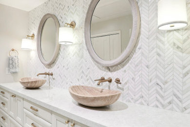 Mid-sized master marble tile double-sink bathroom photo in San Francisco with white cabinets, a vessel sink, quartz countertops, white countertops and a built-in vanity