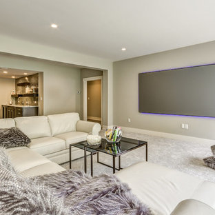 Design ideas for a traditional open plan home cinema in Other with grey walls, carpet, a projector screen and grey floors.