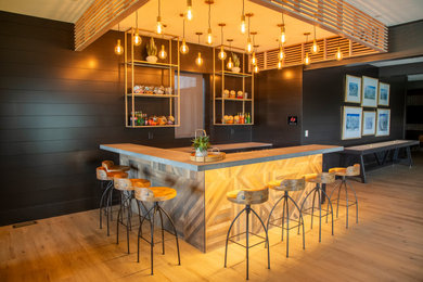 Example of a trendy home bar design in Denver