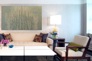 Example of a large minimalist open concept dark wood floor living room library design in New York with gray walls and a standard fireplace