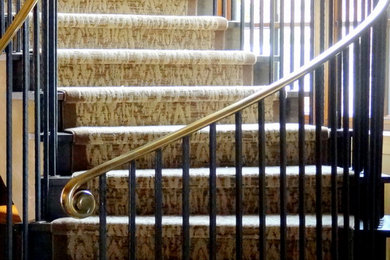 Mid-sized transitional carpeted curved staircase photo in San Francisco with carpeted risers