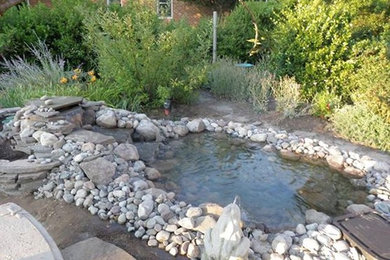 Design ideas for a traditional backyard water fountain landscape in Other.