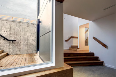 Example of a minimalist basement design in Ottawa