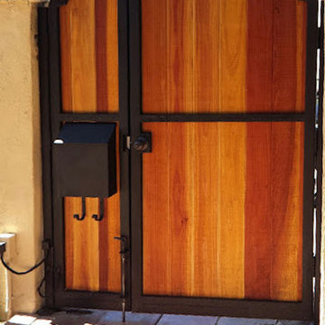 Wood entry gate, iron braced