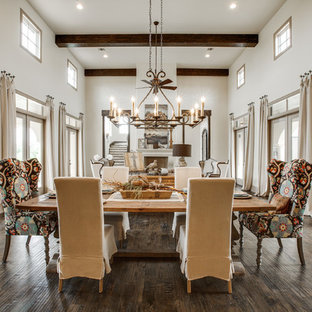 Expansive mediterranean open plan dining in Dallas with white walls and dark hardwood floors.