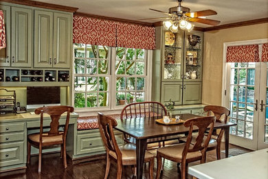 Example of a large classic galley dark wood floor eat-in kitchen design in Dallas with an undermount sink, raised-panel cabinets, green cabinets, green backsplash, ceramic backsplash, stainless steel appliances and a peninsula