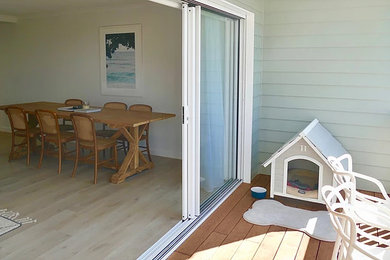 This is an example of a beach style deck in Gold Coast - Tweed.