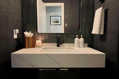 Example of a small trendy 3/4 green tile and subway tile cement tile floor, gray floor, single-sink and wallpaper bathroom design in Dallas with flat-panel cabinets, black cabinets, a two-piece toilet, black walls, an undermount sink, quartz countertops, white countertops, a niche and a floating vanity
