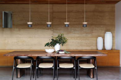 Inspiration for a mid-sized contemporary kitchen/dining combo in Sydney with concrete floors.