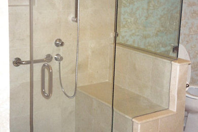 Inspiration for a beige tile and ceramic tile ceramic tile corner shower remodel in Baltimore with a pedestal sink, medium tone wood cabinets, granite countertops, a two-piece toilet and beige walls