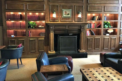 Example of a large classic formal and enclosed carpeted living room design in San Francisco with a standard fireplace and a wood fireplace surround