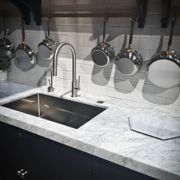 White Carrara Marble with White subway backsplash tiles