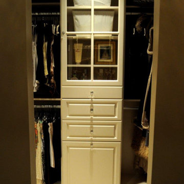 Walk-in Closet with Built-in Hamper and Glass Cabinet