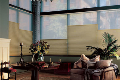 Living room - mid-sized traditional formal and enclosed light wood floor and brown floor living room idea in Montreal with green walls, a standard fireplace, a wood fireplace surround and no tv