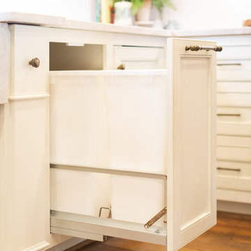 Convenient pull-out trash cans.