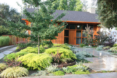 Mid-sized asian one-storey brown exterior in Orange County with wood siding and a gable roof.
