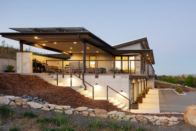 Inspiration for an industrial two-storey house exterior in San Luis Obispo with metal siding.