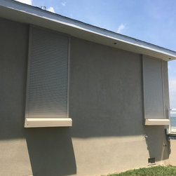 Motorized Rolling Hurricane Shutters- Mulheron Home - Products