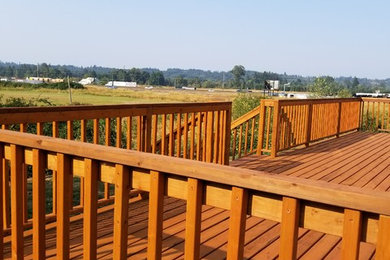 Inspiration for a large timeless backyard deck remodel in Seattle with no cover