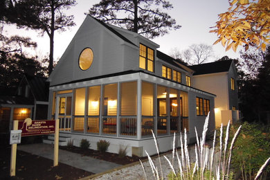 Inspiration for a mid-sized craftsman white two-story concrete fiberboard gable roof remodel in Philadelphia