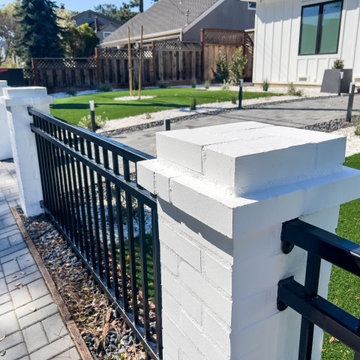 Modern Low-Maintenance Front Yard with Custom Fence and Artificial Turf