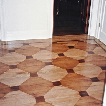 Faux wood inlay painted floor over wide plank pine.