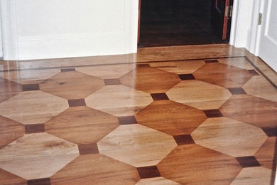 Faux wood inlay painted floor over wide plank pine.