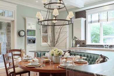 Eat-in kitchen - traditional dark wood floor and brown floor eat-in kitchen idea in Denver with white cabinets, gray backsplash, subway tile backsplash, paneled appliances, an island and gray countertops