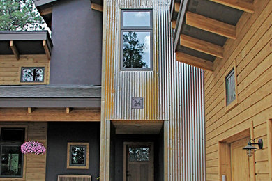 Large craftsman gray two-story mixed siding house exterior idea in Albuquerque with a shed roof and a shingle roof
