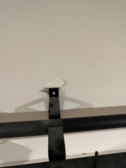 How to fix curtain rod anchor that was ripped out