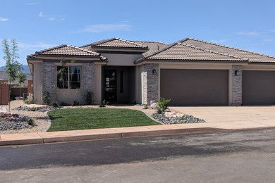 Inspiration for a mid-sized transitional multicolored one-story stone house exterior remodel in Other