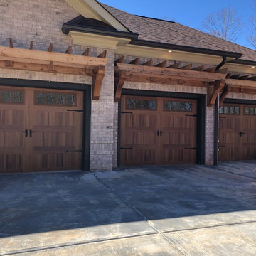Traditional Custom Home Cedar Garage Doors Pergola