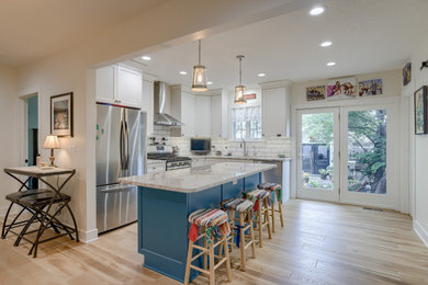 Eat-in kitchen - small transitional l-shaped eat-in kitchen idea in Other with recessed-panel cabinets, turquoise cabinets, quartz countertops and an island