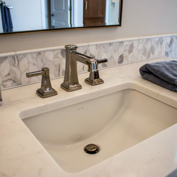 Luxury Spa Bathroom with Natural Warm Vanities, Quartz Countertop, Tiled Shower