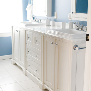 Blue Bathroom with A Double Vanity and Twin Medicine Cabinets