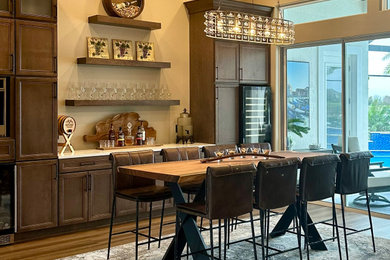 Large tuscan living room photo in Orlando with a bar