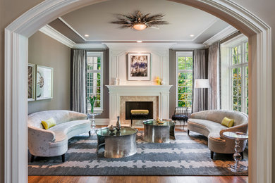 Living room - mid-sized contemporary enclosed and formal dark wood floor and brown floor living room idea in Philadelphia with gray walls, a standard fireplace, a stone fireplace and no tv