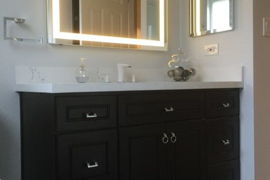 Example of a mid-sized transitional 3/4 porcelain tile and gray floor bathroom design in San Francisco with raised-panel cabinets, black cabinets, gray walls, an undermount sink, quartzite countertops and white countertops